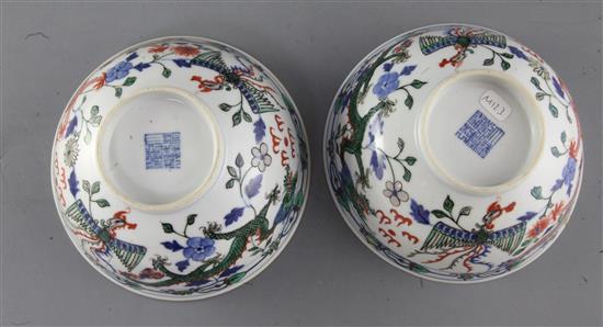 A pair of Chinese doucai dragon bowls, late 19th/early 20th century, diameter 15cm, one with small reglued chip to rim